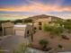 Stunning desert property with a large home and manicured landscaping at 7628 E Mary Sharon Dr, Scottsdale, AZ 85266