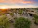 Aerial view of the property, showcasing the house and desert landscape at 7628 E Mary Sharon Dr, Scottsdale, AZ 85266