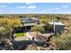 Aerial view showcases the home's unique design and expansive backyard at 7628 E Mary Sharon Dr, Scottsdale, AZ 85266