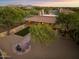 Aerial view showcasing the house's backyard and desert setting at 7628 E Mary Sharon Dr, Scottsdale, AZ 85266