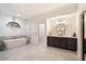 Elegant bathroom with a large soaking tub and double vanity at 7628 E Mary Sharon Dr, Scottsdale, AZ 85266