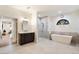 Spa-like bathroom with soaking tub, walk-in shower, and dual vanity at 7628 E Mary Sharon Dr, Scottsdale, AZ 85266