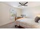 Bright bedroom with a comfortable bed and window seat at 7628 E Mary Sharon Dr, Scottsdale, AZ 85266