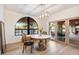 Charming breakfast nook with a marble table and access to a patio at 7628 E Mary Sharon Dr, Scottsdale, AZ 85266