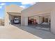 Spacious three-car garage with ample storage; one car is shown parked inside at 7628 E Mary Sharon Dr, Scottsdale, AZ 85266