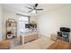 Home office with built-in shelving and a standing desk at 7628 E Mary Sharon Dr, Scottsdale, AZ 85266