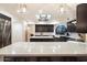 Modern kitchen features a large island and white quartz countertops at 7628 E Mary Sharon Dr, Scottsdale, AZ 85266