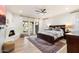 Bright main bedroom with fireplace, TV, and access to backyard at 7628 E Mary Sharon Dr, Scottsdale, AZ 85266