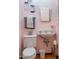 Small vintage bathroom with pink walls and double sink at 363 E Monte Vista Rd, Phoenix, AZ 85004