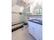 Elegant bathroom with black and white tile and modern vanity at 363 E Monte Vista Rd, Phoenix, AZ 85004