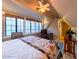 Large bedroom with hardwood floors and multiple windows at 363 E Monte Vista Rd, Phoenix, AZ 85004