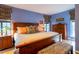 Main bedroom with king-size bed, wooden furniture, and patterned rug at 363 E Monte Vista Rd, Phoenix, AZ 85004
