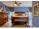 Main bedroom with king-size bed, wooden furniture, and ceiling fan at 363 E Monte Vista Rd, Phoenix, AZ 85004