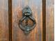 Close-up of ornately detailed front door knocker at 363 E Monte Vista Rd, Phoenix, AZ 85004