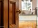 Close-up of an ornate wood door with brass knob at 363 E Monte Vista Rd, Phoenix, AZ 85004