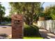 Entrance to Los Olivos community, established in 1959, with brick pillars and a white fence at 363 E Monte Vista Rd, Phoenix, AZ 85004