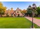 Charming Tudor-style home with manicured lawn and walkway at 363 E Monte Vista Rd, Phoenix, AZ 85004