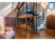 Game room with spiral staircase, loft, and exposed brick walls at 363 E Monte Vista Rd, Phoenix, AZ 85004