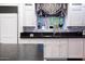 Modern kitchen with sink, granite countertop, and white cabinets at 363 E Monte Vista Rd, Phoenix, AZ 85004