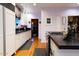 White kitchen cabinets, granite countertops, and hardwood floors at 363 E Monte Vista Rd, Phoenix, AZ 85004