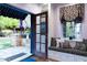 Kitchen with French doors opening to a patio, built-in bench seating, and backyard view at 363 E Monte Vista Rd, Phoenix, AZ 85004