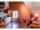 Small kitchenette with brick feature wall and leather armchairs at 363 E Monte Vista Rd, Phoenix, AZ 85004
