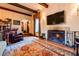 Living room with fireplace, hardwood floors, and comfy seating at 363 E Monte Vista Rd, Phoenix, AZ 85004