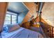 Cozy loft bedroom with wood and brick details at 363 E Monte Vista Rd, Phoenix, AZ 85004