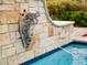 Close-up of the pool's unique Medusa fountain feature at 363 E Monte Vista Rd, Phoenix, AZ 85004