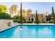 Lush pool area with a charming guest house visible in the background at 363 E Monte Vista Rd, Phoenix, AZ 85004
