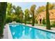 Long, refreshing pool view with a charming guest house in the background at 363 E Monte Vista Rd, Phoenix, AZ 85004
