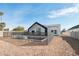 Backyard showcasing modern home design and pool with safety fence at 2136 E Paradise Ln, Phoenix, AZ 85022