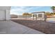 Backyard displaying a fenced in pool construction and a modern home at 2136 E Paradise Ln, Phoenix, AZ 85022