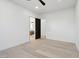 Bedroom with hardwood floors, a modern ceiling fan, neutral walls, and an ensuite bathroom at 2136 E Paradise Ln, Phoenix, AZ 85022