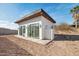 Rear exterior view of a white cabana with a brown roofline and large sliding glass doors at 2136 E Paradise Ln, Phoenix, AZ 85022