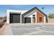 Modern home featuring a striking architecture, dual garage, and contemporary design elements at 2136 E Paradise Ln, Phoenix, AZ 85022