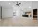 Open-concept living area with hardwood floors, high ceilings, and modern lighting fixtures at 2136 E Paradise Ln, Phoenix, AZ 85022