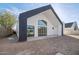 Modern home featuring a white exterior, a black roof line and large sliding glass doors at 2136 E Paradise Ln, Phoenix, AZ 85022