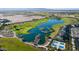Aerial view of lake with golf course in stunning new community at 12075 N San Clemente St, Surprise, AZ 85388