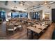 Restaurant dining area with natural wood tables, upholstered chairs and mountain views at 12075 N San Clemente St, Surprise, AZ 85388