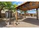 Spacious backyard features a covered patio and shed perfect for entertaining at 12943 W Mclellan Rd, Glendale, AZ 85307