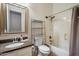 Well-maintained bathroom featuring a granite vanity top and shower-tub combo at 12943 W Mclellan Rd, Glendale, AZ 85307