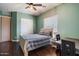 Comfortable bedroom features hardwood floors, a ceiling fan, and a neutral color palette at 12943 W Mclellan Rd, Glendale, AZ 85307