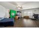 Spacious bedroom with hardwood floors, ceiling fan, and bright natural light at 12943 W Mclellan Rd, Glendale, AZ 85307
