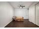 Neutral bedroom featuring hardwood floors, ceiling fan, and closet at 12943 W Mclellan Rd, Glendale, AZ 85307