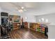 Versatile bonus room featuring laminate flooring, neutral walls, and abundant natural light at 12943 W Mclellan Rd, Glendale, AZ 85307