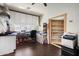 This garage features ample storage with white cabinets and a workstation for projects at 12943 W Mclellan Rd, Glendale, AZ 85307