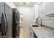Kitchen with stainless steel appliances and granite countertops at 12943 W Mclellan Rd, Glendale, AZ 85307