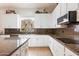 Kitchen with granite countertops, stainless steel appliances, and an island at 12943 W Mclellan Rd, Glendale, AZ 85307