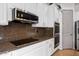 Modern kitchen features granite countertops and stainless steel appliances at 12943 W Mclellan Rd, Glendale, AZ 85307
